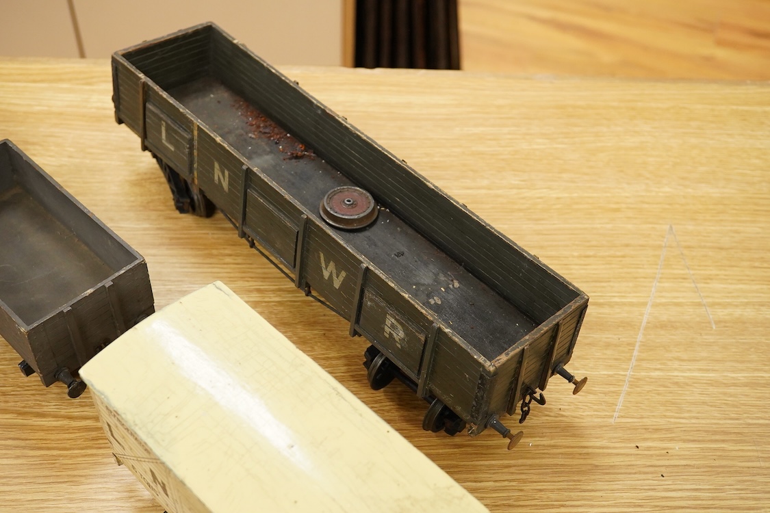 A Gauge One live steam 0-4-0T locomotive in the style of a Bowman model locomotive, with spirit fired with two simple outside oscillating cylinders, together with five LNWR and Midland Railway freight wagons, including a